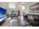 Bright living room featuring tile floors, ceiling fan, and large windows at 6936 77Th N Ter, Pinellas Park, FL 33781