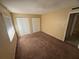 Bedroom featuring neutral walls, carpet, natural light from the window and double-door closet at 7507 Presley Pl # D, Tampa, FL 33617