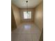 Bright dining area featuring neutral paint, tile floors, and a window with a pleasant view at 7507 Presley Pl # D, Tampa, FL 33617