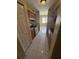 Efficient kitchen featuring tile floors, wooden cabinets and modern stainless steel appliances at 7507 Presley Pl # D, Tampa, FL 33617