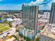 High-rise apartment building with a pool deck and stunning downtown views on a clear sunny day at 777 N Ashley Dr # 1516, Tampa, FL 33602