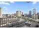 Condo balcony showcasing expansive cityscape views, with comfortable seating perfect for relaxing and enjoying the scenery at 777 N Ashley Dr # 1516, Tampa, FL 33602