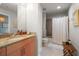 Neutral bathroom featuring a granite countertop and a bathtub with a shower at 777 N Ashley Dr # 1516, Tampa, FL 33602