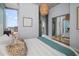 Modern bedroom with a large mirror closet and a cityscape view through the window at 777 N Ashley Dr # 1516, Tampa, FL 33602