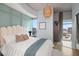 Stylish bedroom featuring a soft headboard, unique light fixture, and cityscape view at 777 N Ashley Dr # 1516, Tampa, FL 33602