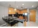 Contemporary kitchen with marble counters, stainless appliances, breakfast bar, and ample cabinet space at 777 N Ashley Dr # 1516, Tampa, FL 33602