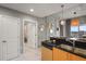 Bright kitchen with stainless sink, dishwasher, modern cabinetry, and an open doorway to other rooms at 777 N Ashley Dr # 1516, Tampa, FL 33602