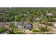 Aerial view of a modern home in a neighborhood with mature trees and manicured lawns at 806 W Adalee St, Tampa, FL 33603