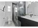Modern bathroom with a glass shower, vanity with sink, and tile flooring at 806 W Adalee St, Tampa, FL 33603