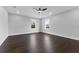 Bright, spacious bedroom with dark wood floors and large windows providing natural light at 806 W Adalee St, Tampa, FL 33603