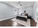 Cozy bedroom with a queen-sized bed, soft rug, and ample natural light from the window at 806 W Adalee St, Tampa, FL 33603