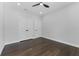 Well-lit bedroom with dark wood floors and a double-door closet for convenient storage at 806 W Adalee St, Tampa, FL 33603