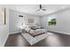 Serene bedroom featuring hardwood floors, large windows, and a plush bed with elegant linens at 806 W Adalee St, Tampa, FL 33603