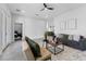 Open-concept living room with comfortable seating, stylish decor, and access to the kitchen at 806 W Adalee St, Tampa, FL 33603