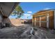 Spacious backyard with storage shed and partial fencing, offering privacy at 8325 Elkwood Ln, Tampa, FL 33615