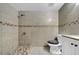 Bathroom features tiled walls, walk-in shower, and modern toilet at 8325 Elkwood Ln, Tampa, FL 33615