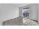 Bedroom with tiled floor and bright window at 8325 Elkwood Ln, Tampa, FL 33615