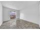 Bright bedroom with tiled floor and window at 8325 Elkwood Ln, Tampa, FL 33615