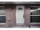 Exterior view of the front door showcasing its architectural details and secure entry at 8325 Elkwood Ln, Tampa, FL 33615