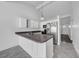 Well-lit kitchen with stainless steel appliances and a breakfast bar area at 8325 Elkwood Ln, Tampa, FL 33615