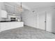 Open-concept kitchen and dining area with neutral color scheme and ample natural light at 8325 Elkwood Ln, Tampa, FL 33615