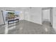 Bright living room featuring tile floors and an open floor plan with ample natural light at 8325 Elkwood Ln, Tampa, FL 33615