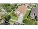 Aerial view of a well-maintained house with mature landscaping, located in a residential neighborhood at 9008 Quail Creek Dr, Tampa, FL 33647