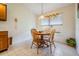 Cozy breakfast nook with wooden table and chairs near the kitchen at 9008 Quail Creek Dr, Tampa, FL 33647