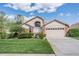 Lovely single-Gathering home with well-maintained landscaping and an attached two-car garage at 9008 Quail Creek Dr, Tampa, FL 33647