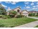 Charming single-Gathering home featuring a manicured lawn and traditional architectural details at 9008 Quail Creek Dr, Tampa, FL 33647