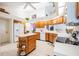 View of kitchen featuring wood cabinets and a bright kitchen island at 9008 Quail Creek Dr, Tampa, FL 33647