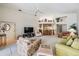 Spacious living room with a vaulted ceiling, bar, and lots of comfortable seating at 9008 Quail Creek Dr, Tampa, FL 33647