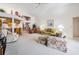 Spacious living room with vaulted ceilings and comfortable seating at 9008 Quail Creek Dr, Tampa, FL 33647