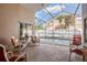 Relaxing screened patio with comfortable seating and a view of the refreshing backyard pool at 9008 Quail Creek Dr, Tampa, FL 33647