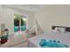 Bedroom features a teepee, furniture and a view of the patio at 9107 Bay Ne St, St Petersburg, FL 33702