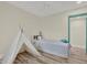 Bright bedroom features hardwood floors and a decorative teepee at 9107 Bay Ne St, St Petersburg, FL 33702