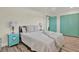 Comfortable bedroom with starfish lamps, ensuite and aqua trim throughout at 9107 Bay Ne St, St Petersburg, FL 33702