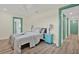 Cozy bedroom features neutral tones, a ceiling fan, and an ensuite bathroom at 9107 Bay Ne St, St Petersburg, FL 33702
