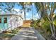 Property featuring private side yard, enhanced by lush trees, offering a serene and secluded outdoor experience at 9107 Bay Ne St, St Petersburg, FL 33702