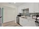 Bright kitchen with stainless steel appliances, subway tile backsplash, and ample counter space at 9107 Bay Ne St, St Petersburg, FL 33702