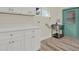 Functional laundry room with painted door, featuring ample counter space and a sink, making laundry tasks a breeze at 9107 Bay Ne St, St Petersburg, FL 33702