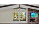 Bright living room featuring a fireplace, large windows overlooking the yard, and neutral paint at 9107 Bay Ne St, St Petersburg, FL 33702