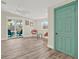 Inviting room with airy fan, sliding doors to patio, and painted door, creating a seamless indoor-outdoor living experience at 9107 Bay Ne St, St Petersburg, FL 33702