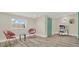Living room with painted door, complemented by stylish furniture and art for a cozy and sophisticated ambiance at 9107 Bay Ne St, St Petersburg, FL 33702
