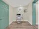 Bright office space with painted doors, featuring a stylish desk setup, perfect for working from home in comfort and style at 9107 Bay Ne St, St Petersburg, FL 33702