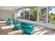 Relaxing screened patio with comfortable seating, ideal for enjoying the outdoors in a private and serene setting at 9107 Bay Ne St, St Petersburg, FL 33702