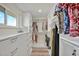 Spacious walk-in closet with custom shelving and storage at 9107 Bay Ne St, St Petersburg, FL 33702