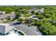 Overhead view of the community featuring a playground, parking, and buildings surrounded by lush landscaping at 9516 Amberdale Ct # 202, Riverview, FL 33569
