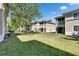Backyard view of a well-maintained lawn and building exteriors at 9516 Amberdale Ct # 202, Riverview, FL 33569