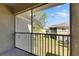 Screened-in balcony with views of the lawn and neighboring building at 9516 Amberdale Ct # 202, Riverview, FL 33569